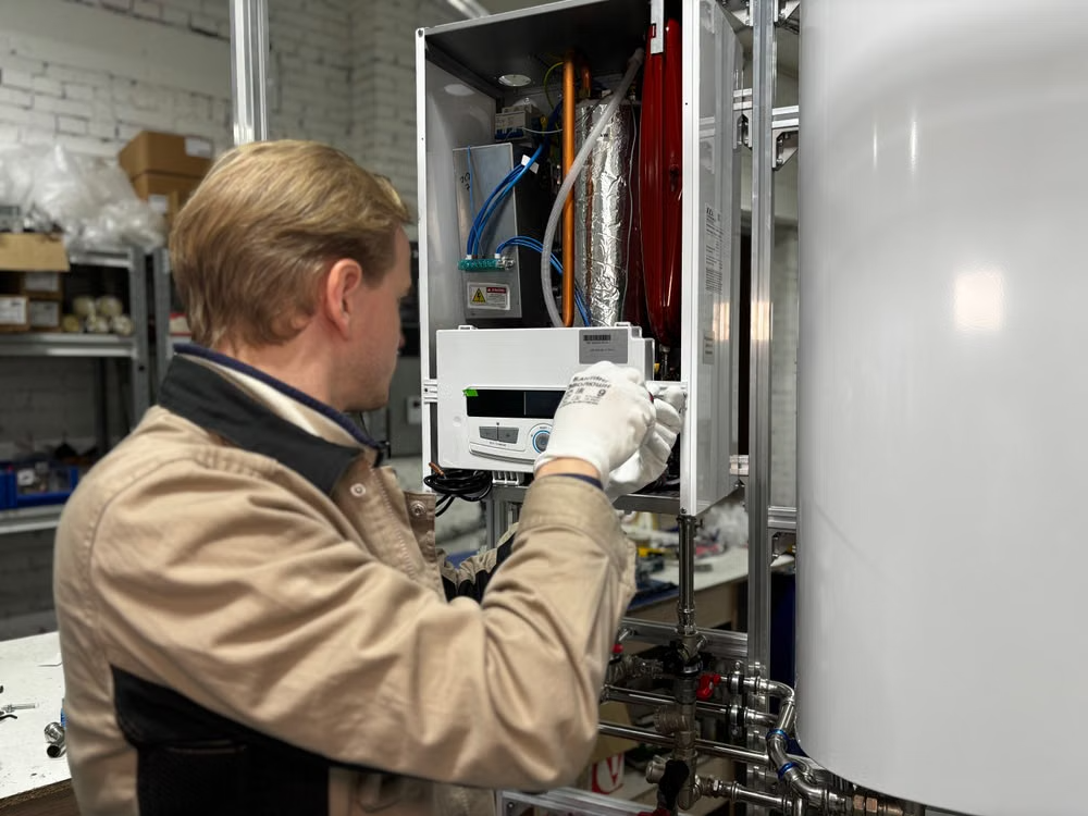 a plumber repairing a water heating system